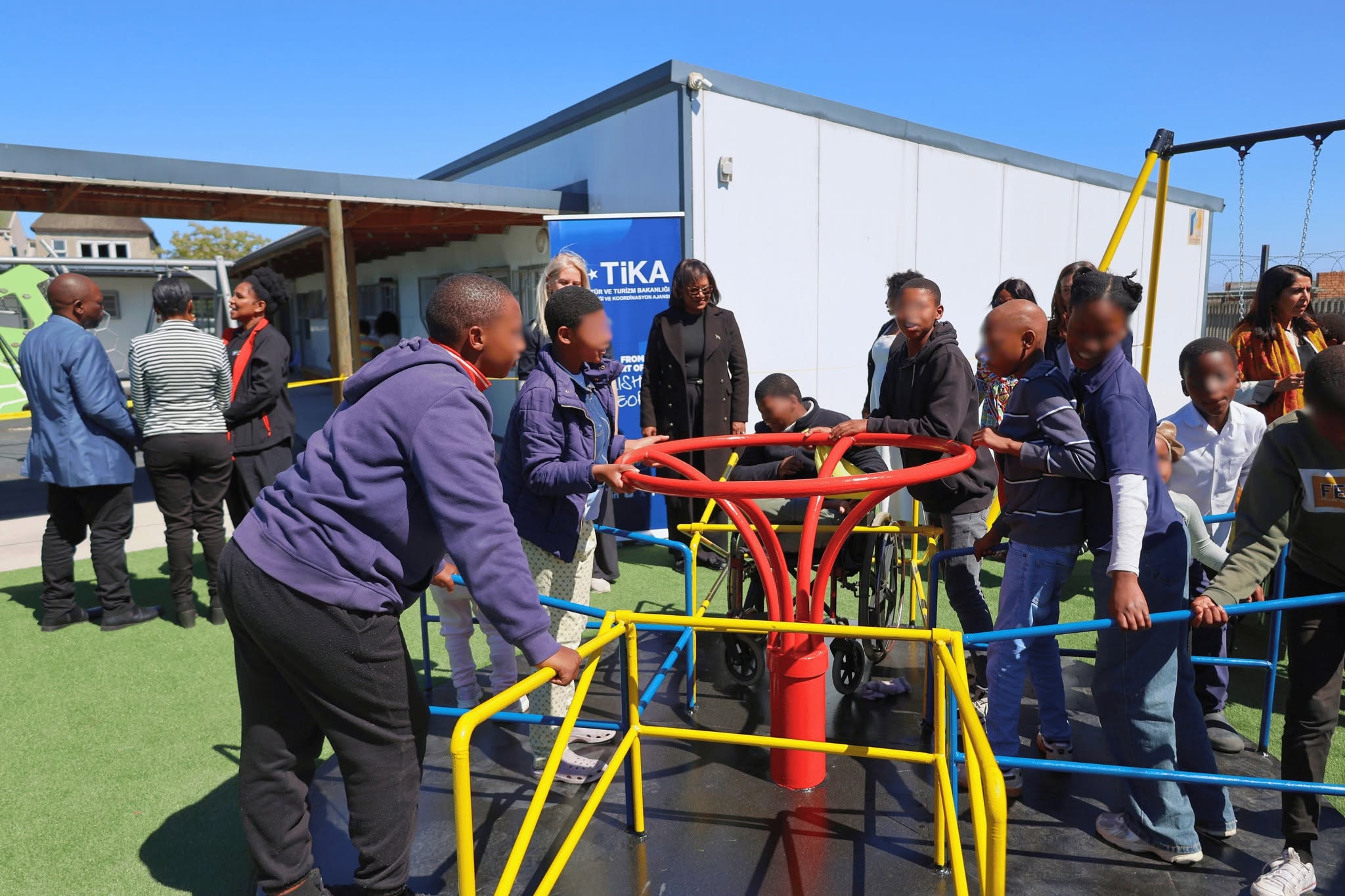 Children play on their new equipment at the Lonwabo Special Care Centre.