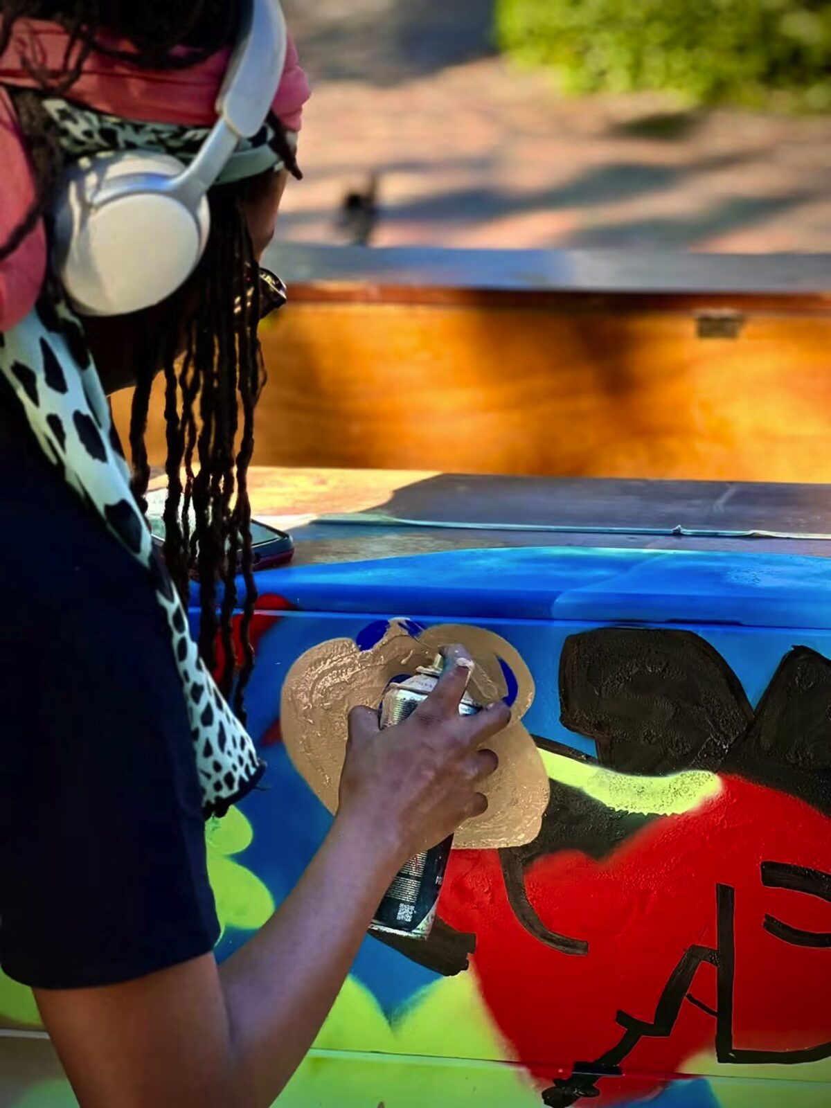 Sanelisiwe Singaphi busy painting one of the pianos.