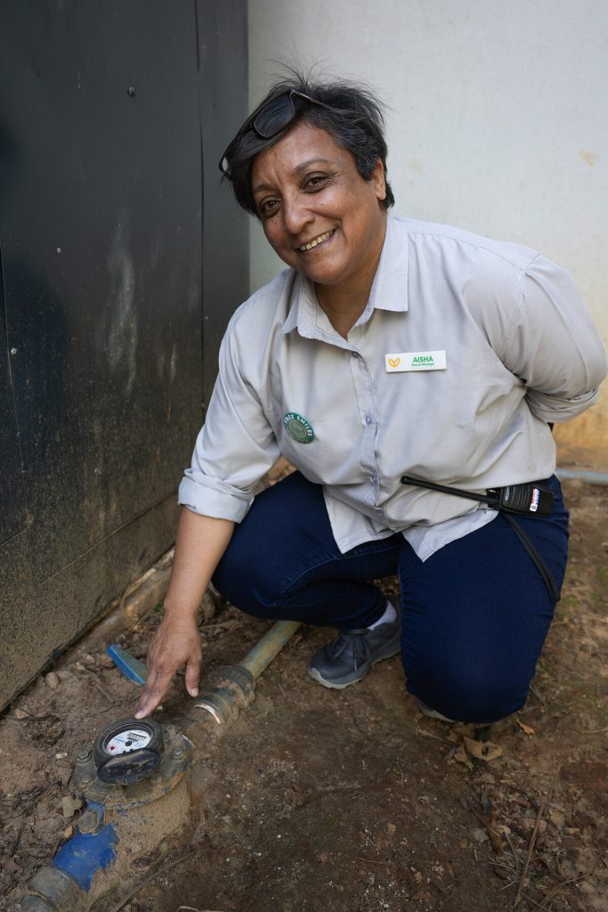 Aisha Arnold, Branch Manager checking water meter