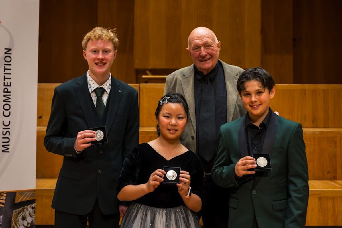 The competition's founder Prof Hubert van der Spuy with the top three, from left: flautist Henning Bouwer (second), pianist Sinran Emilie Yang (winner), and Benjamin Monvoisin (third).