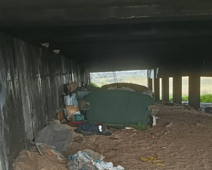 The road surface is damaged because illegal tunnels were dug under it.