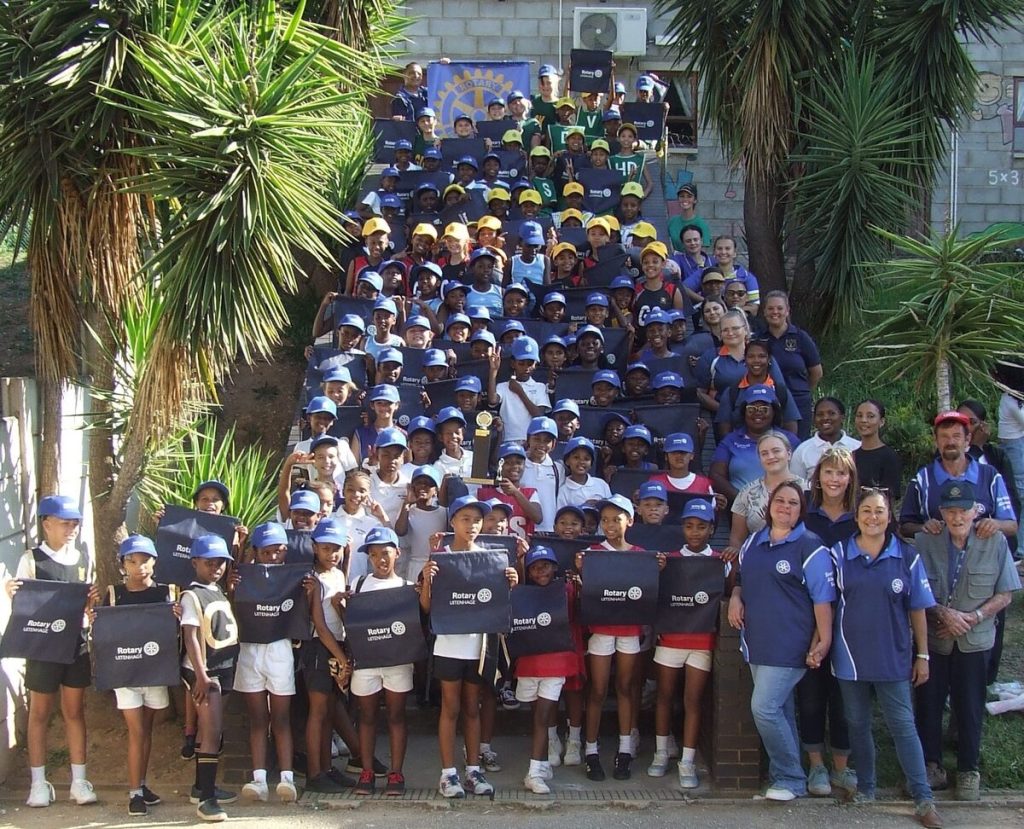 Group photo of all participating teams, coaches and Rotarians of the Super Eleven Netball Tournament 2025.