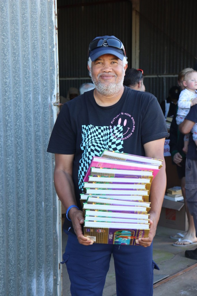 Wayne Mayer, a teacher from Triomf Primary School in Gqeberha thilled to take the books back to his school.