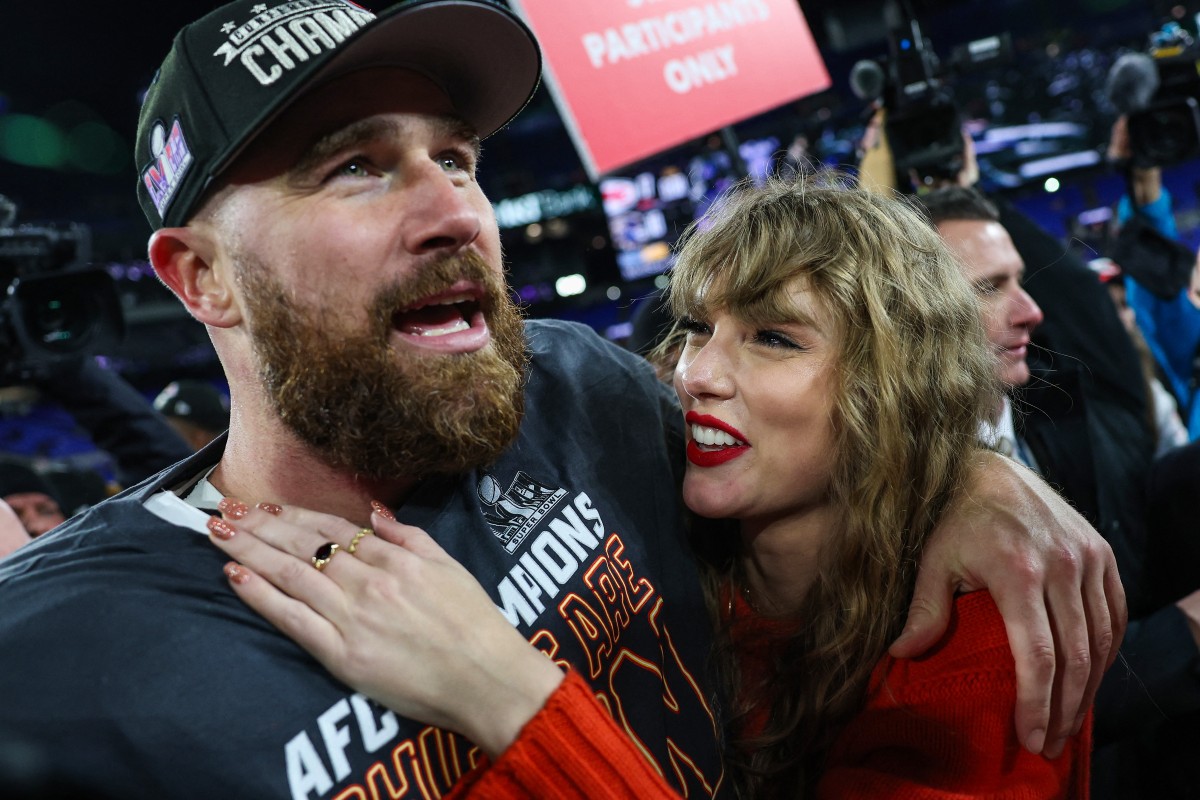 Travis Kelce #87 of the Kansas City Chiefs (L) celebrates with Taylor Swift after defeating the Baltimore Ravens in the AFC Championship Game at M&T Bank Stadium on January 28, 2024 in Baltimore, Maryland. Pop superstar Taylor Swift and American football player Travis Kelce announced their engagement on August 26, 2025, setting the stage for a high-profile wedding for the celebrity couple. A joint post on their Instagram pages showed pictures of Kelce on one knee making his marriage proposal in a flower-laden garden, and then Swift, 35, displaying a large diamond ring. (Photo by Patrick Smith / GETTY IMAGES NORTH AMERICA / AFP)