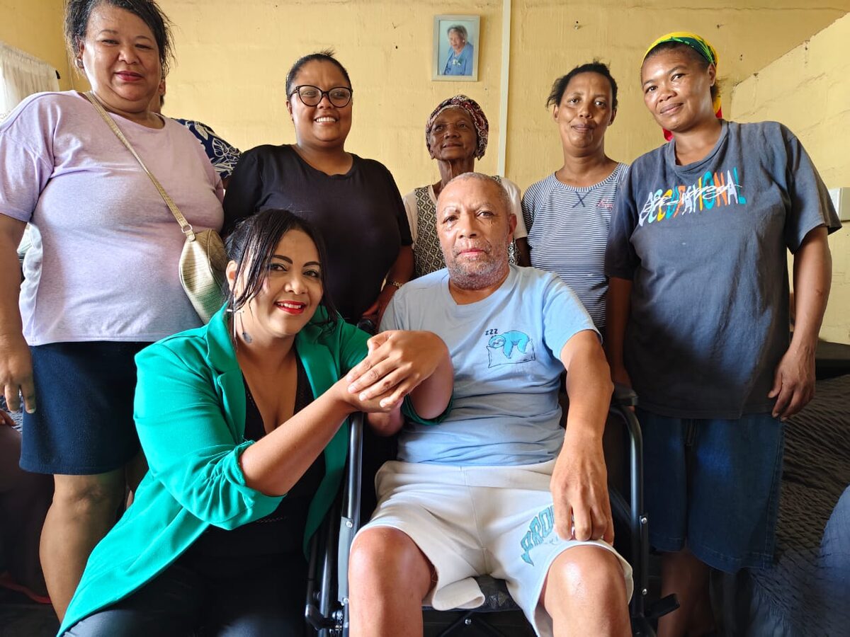 Pictured at the back from the left are Beverley Goliath, Diane Jansen, Elsie Jansen, Nelsie Jansen, Leana Louw. In front are Haylee Gee and uncle Daniel Jansen at the wheelchair handover.