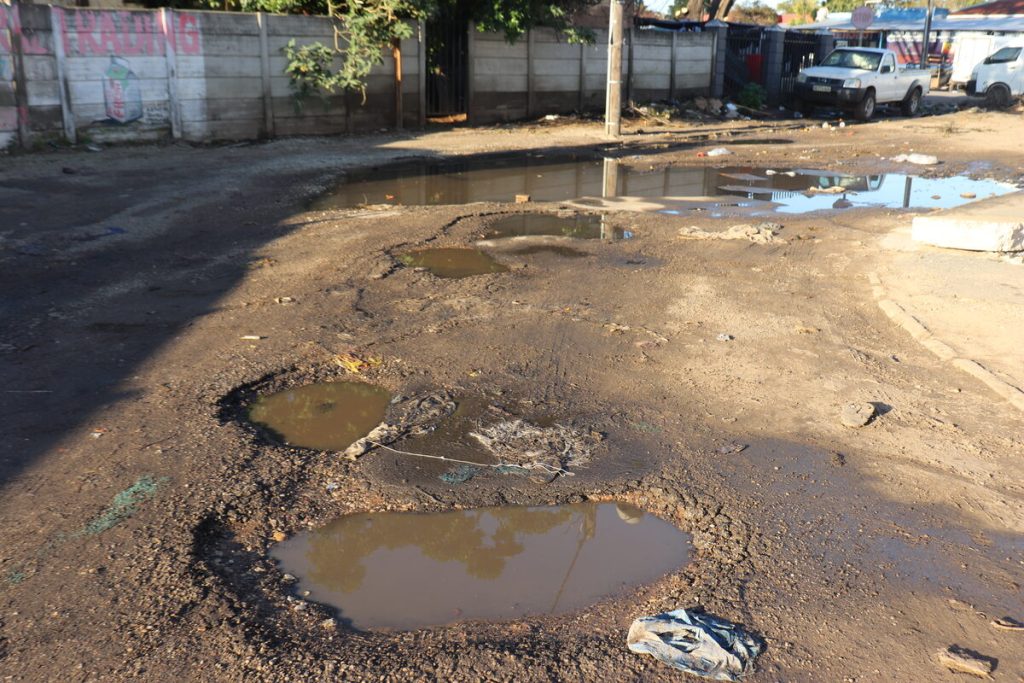 Lower Central residents plagued by major potholes filled by sewage water.