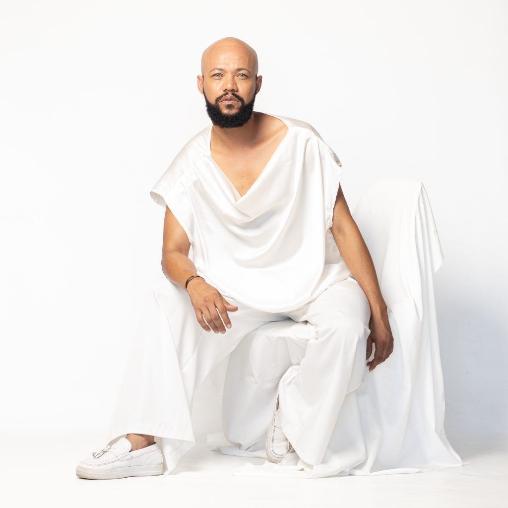 Man posing in front of a camera