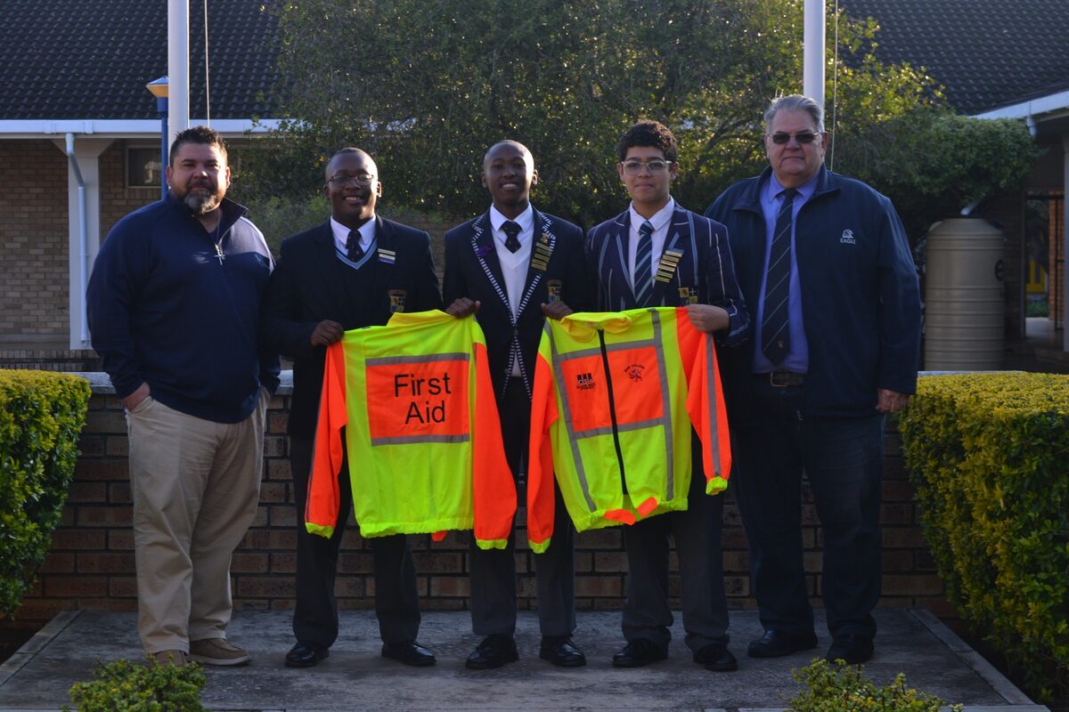 Claude Smith (Claude Smith Attorneys) donated one of many kits to Muir College. Pictured are Claude Smith (CSA), Lathitha Ntwasa, Mbasa Plaatjie, Tyler Heynes and Rob Colley (teacher).