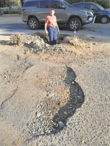 Knee-deep in fixing roads