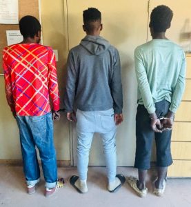 Murder suspects cuffed