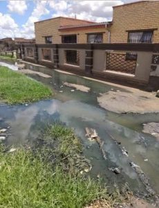 Sewage soaks the houses and streets in Thabong
