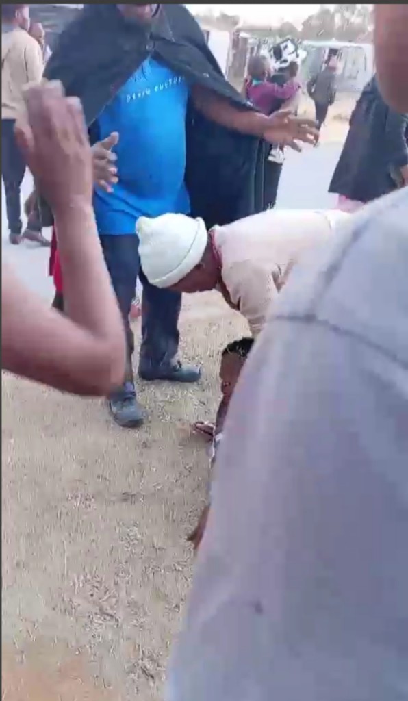 The critically shot and profusely bleeding woman lay some ten metres from a parked police vehicle.