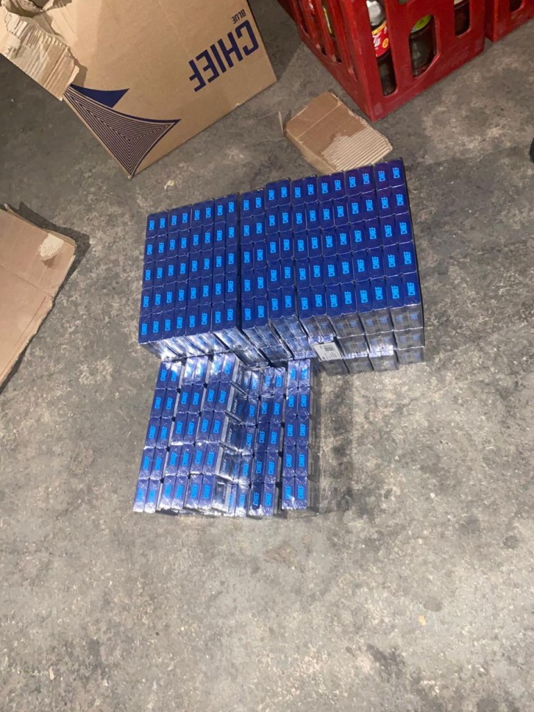 Rolling papers, skin-lightening creams, and boxes of tablets believed to be sold illegally.

