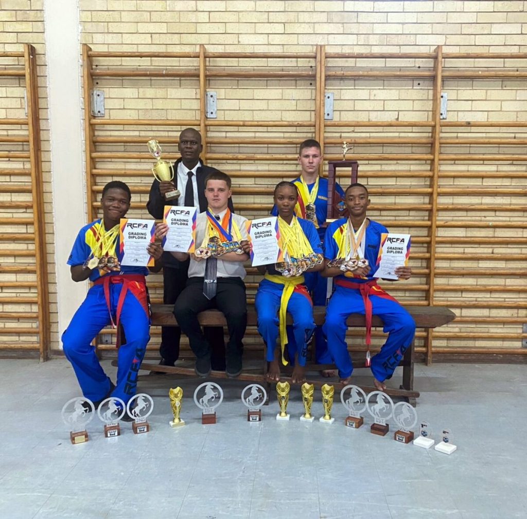 The formidable RCFA Bhubezi Fight Club is prepared for all challenges in 2026. From the left, front: Junior Mosoeunyane (Red Belt), Brandon Kelly (2nd Yellow Belt), Gofaone Sebati (2nd Yellow Belt), and Mohale Notha (1st Blue Belt); back: Sensei Joe Gladstone Ralejoe (3rd degree black belt) and Keagan Smith (2nd Green Belt).  PHOTO: Supplied