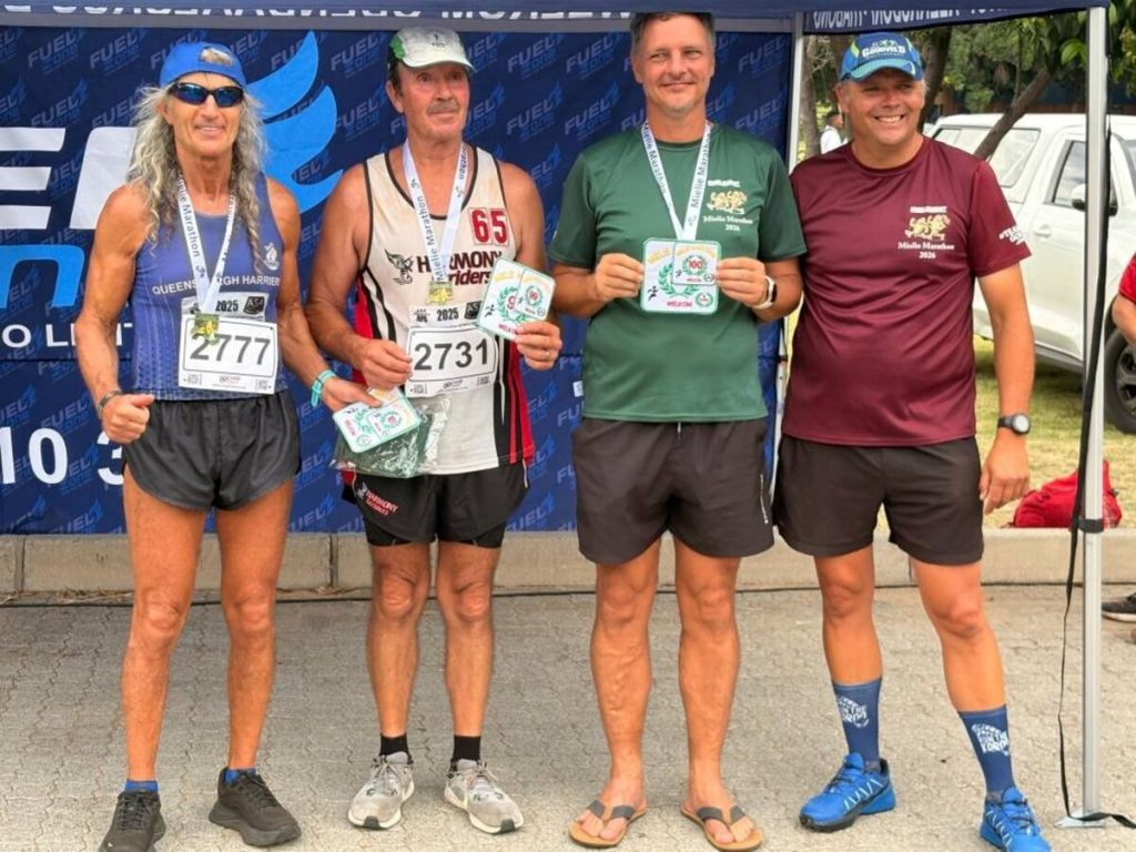 Three marathon runners earned their permanent numbers after completing their 10th Mielie Marathon. This accolade was handed to them by Goudveld Multisport's Club Captain, Marius Bester. From the left are Julian Karp, Rudolph Rabie, Michael Conradie and Bester.  PHOTO: Supplied