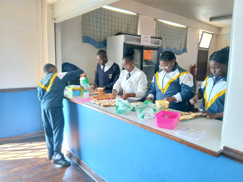 St Dominic's College learners hard at wiork in the soup kitchen