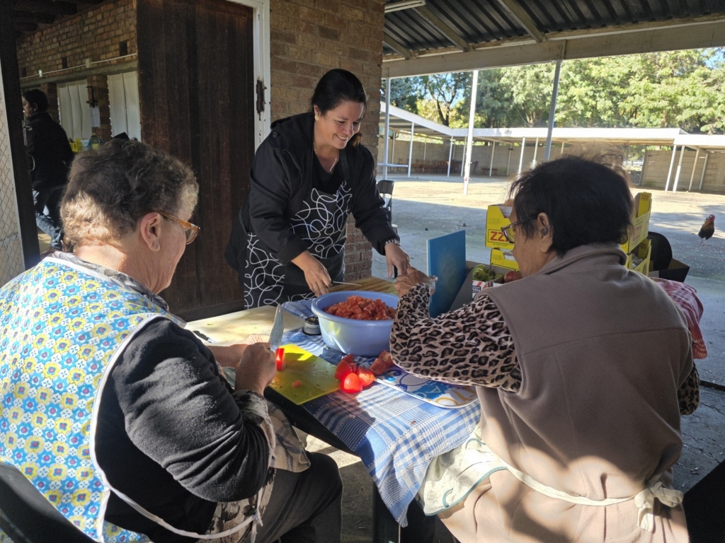 Women from the Catholoic Church prepare some meals