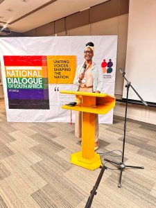 Welkom girl holds the flag high for youngsters at the National Youth Dialogue