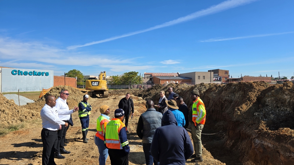 Representatives from DWS, Matjhabeng LM and Checkers doing a site visit on the work currently underway to eradicate sewage spills in the area