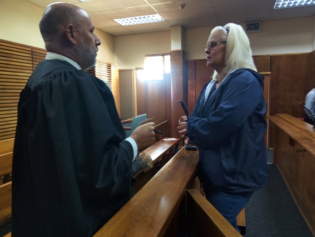 Adv. Allen Simpson consults with Lind van den Heever before sentencing