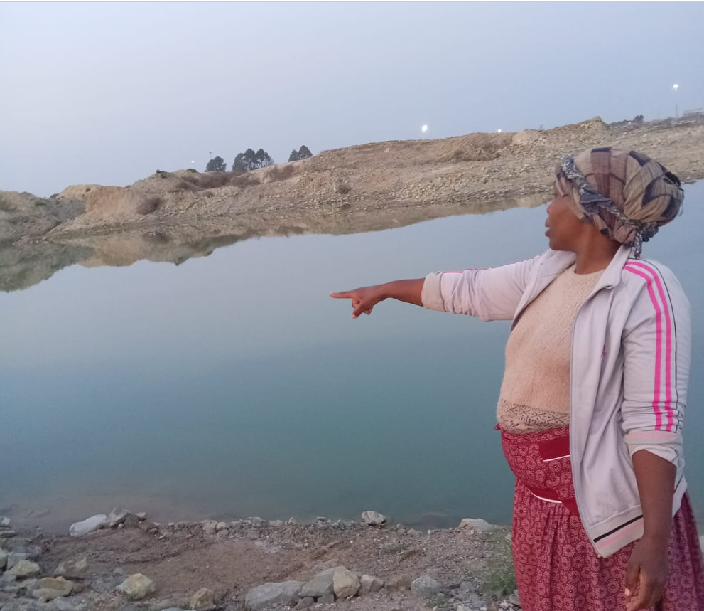 The aunt of Thabo Diloko points out were he drowned