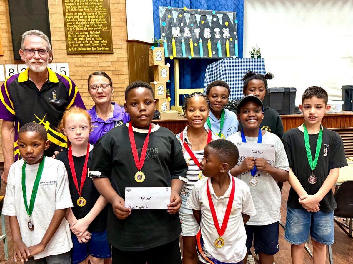 Eight of the top achievers in the Lejweleputswa Chess championships, with their coaches