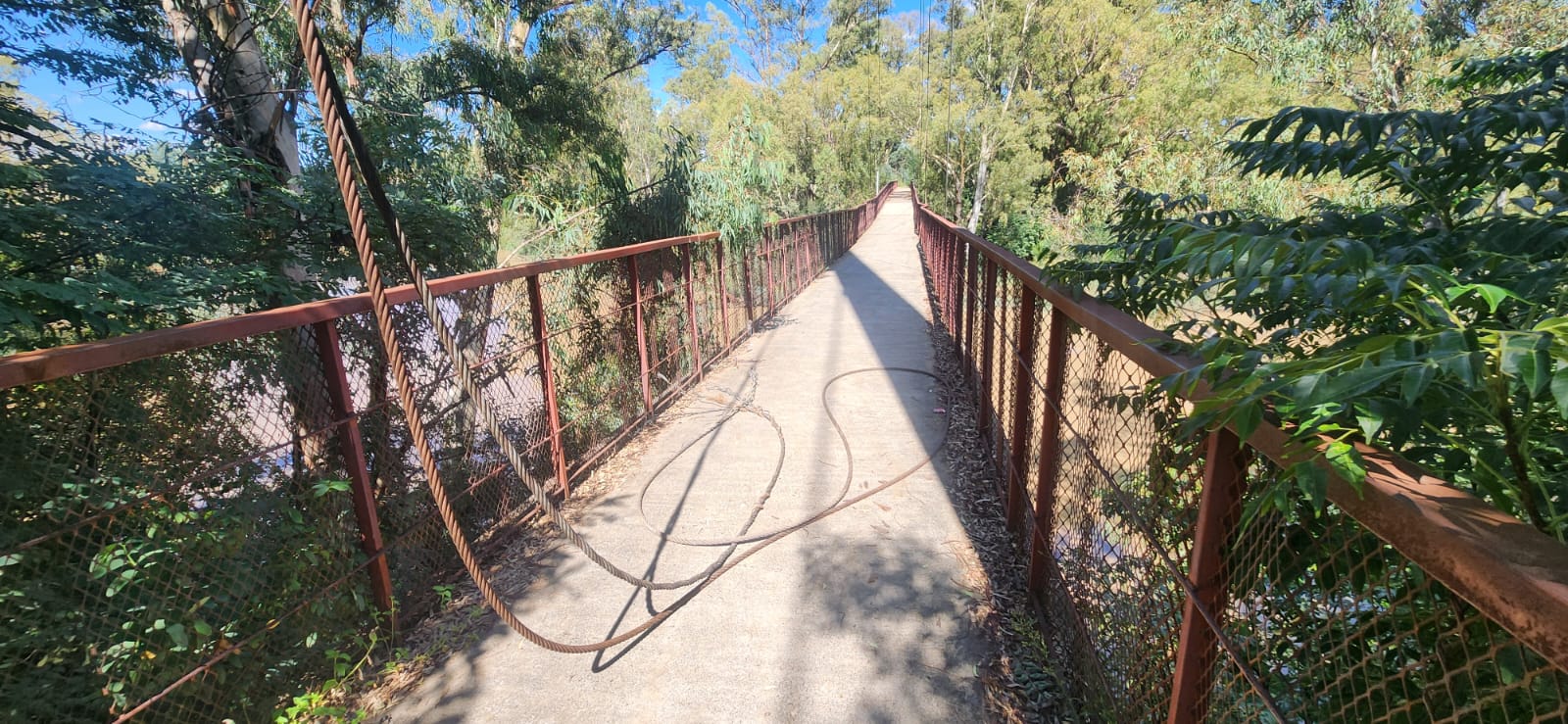 The Kroonstad pedestrian bridge between the Country Club and Botha Street in town has two broken support cables and several more severely damaged. PHOTO: Supplied