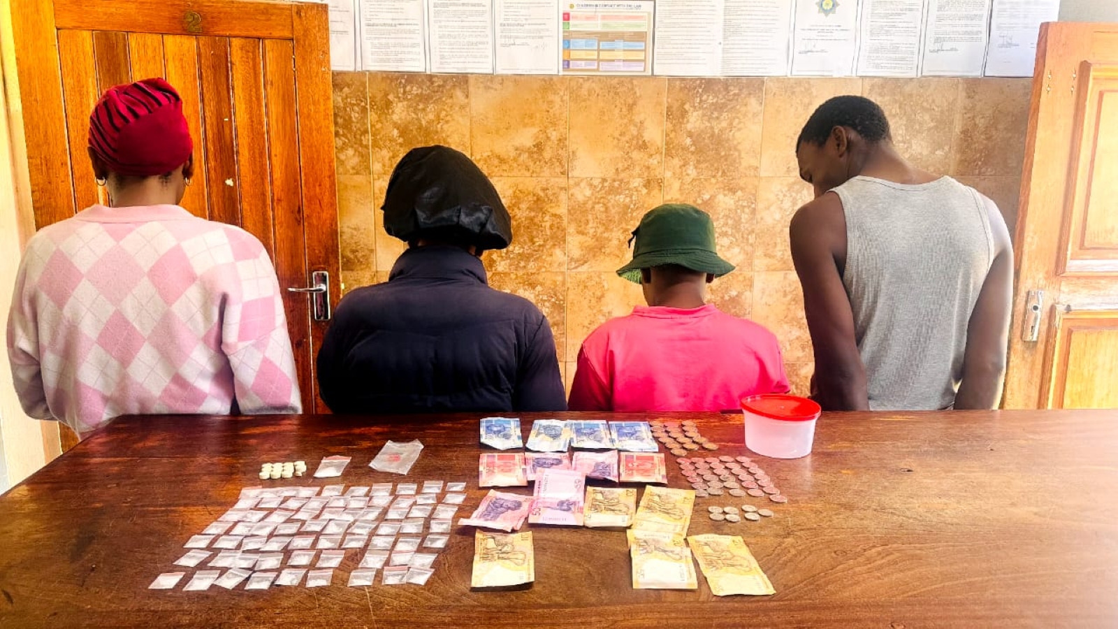 Police display seized firearms and drugs following Easter weekend operations in the Thabo Mofutsanyana District, where 12 suspects were arrested in connection with serious crimes including murder, rape and illegal possession of weapons. PHOTO: Supplied