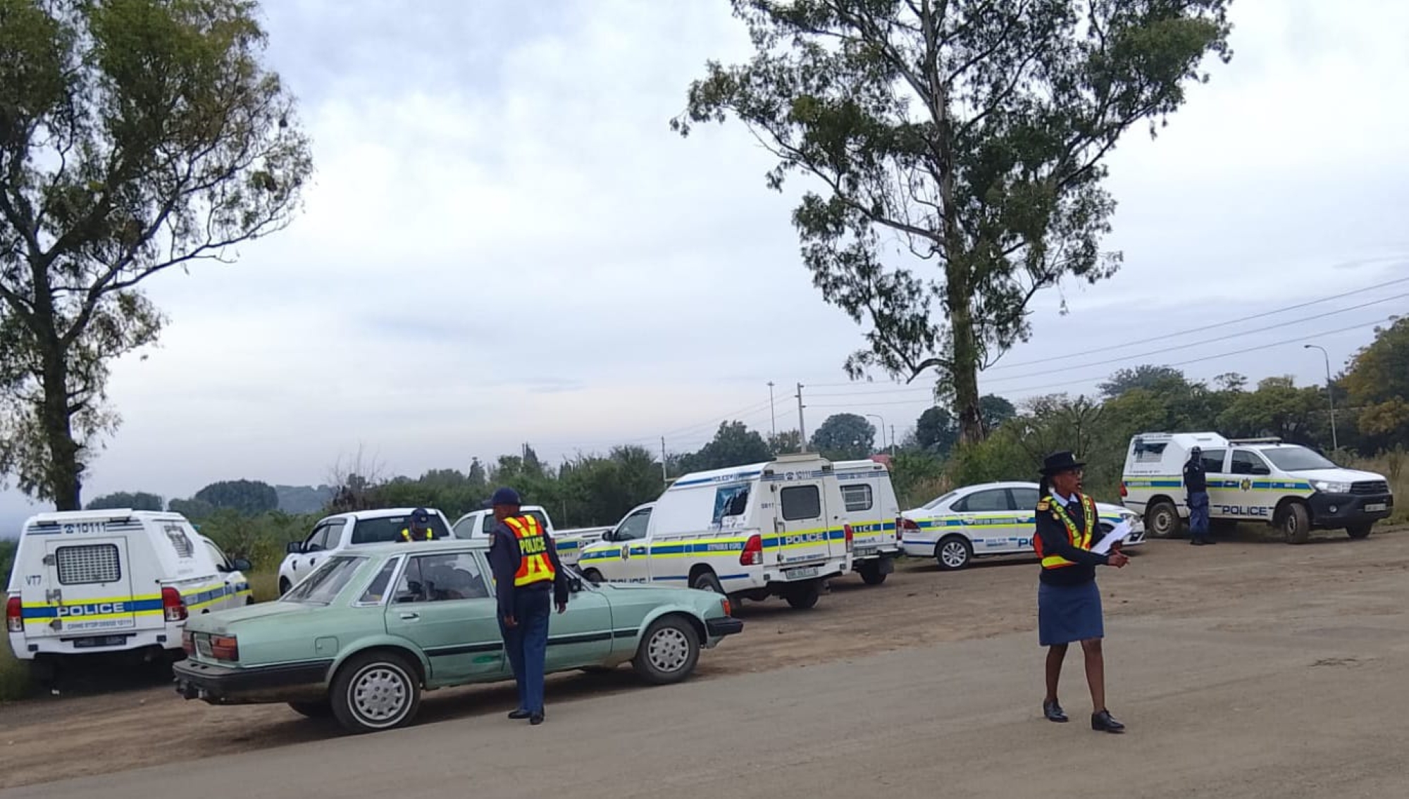 Police officers and community members conduct roadside checks on the Koppies-Kwakwatsi road on Wednesday 15 April, engaging motorists and pedestrians in a campaign promoting road safety and raising awareness of gender-based violence.