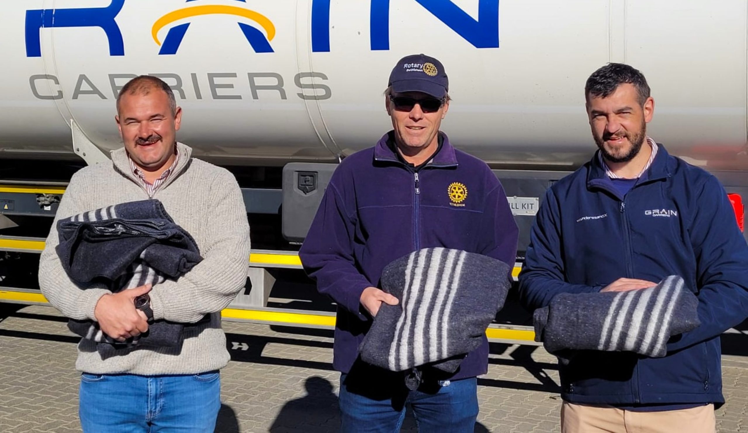 Rotary Bethlehem has joined Grain Carriers in supporting Grain Care's Winter Blanket Drive, an initiative aimed at bringing warmth and comfort to vulnerable members of the community during the cold winter months. Grain Care matches every blanket donated on a one-for-one basis, helping to extend the reach of the campaign's "Share Warmth, Spread Hope" message. From left are Zach Grové (Grain Carriers), Leon Roos (Rotary Bethlehem) and J.C. Moolman (Grain Carriers). Photo:Supplied