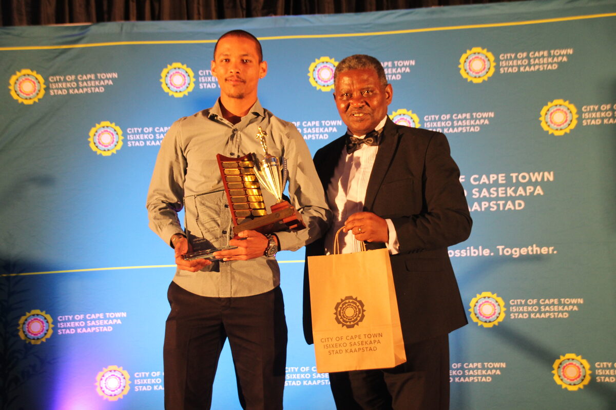 Jaylon Daniels (left) received his Sportman of the year award in Volleyball from councillor Moosa Raise.