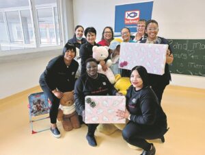 Sea Harvest peer educators donate little beanies