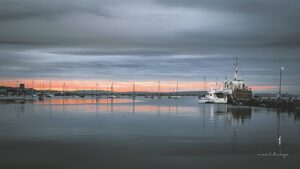 A symphony of greys and pinks complement the sunset