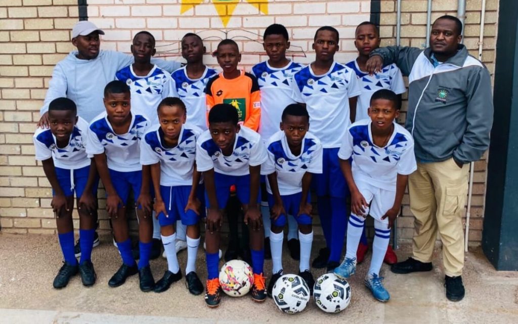 The u-15 boys soccer team from Masiphatisane Primary School.