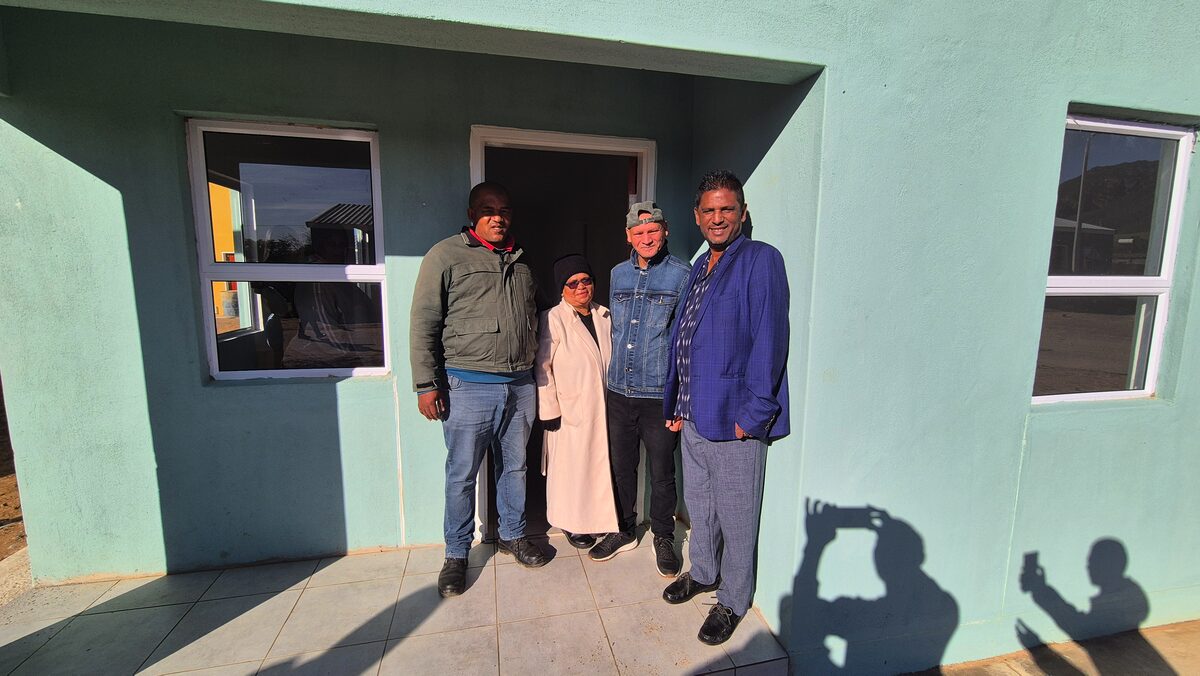 BM hands keys to home owners