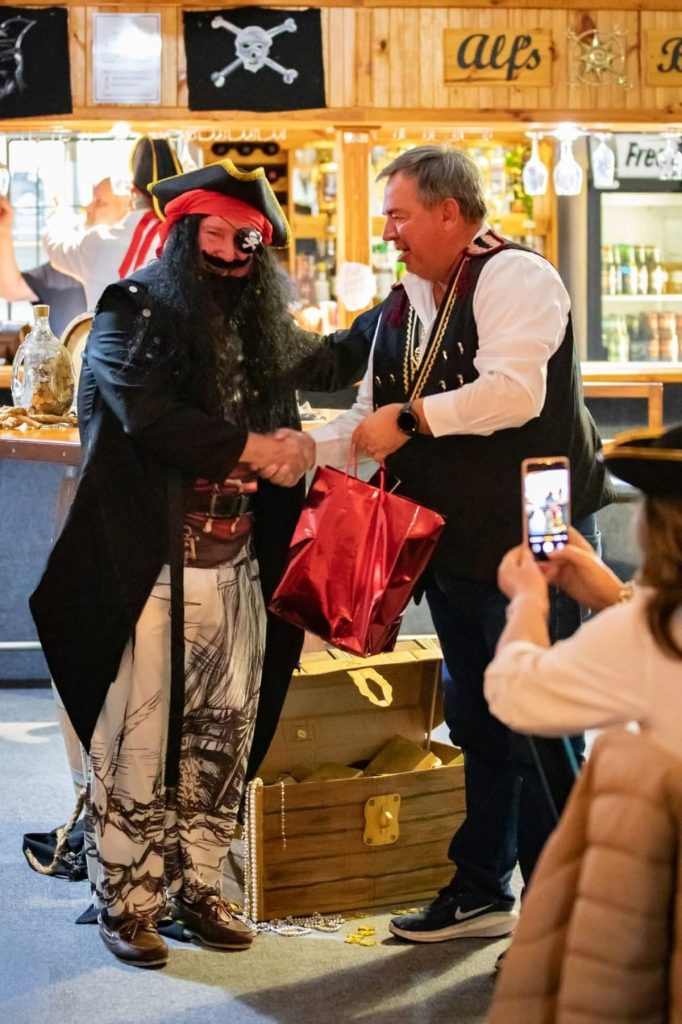 The best dressed man, Commodore Bruce Quayle, receives his award from Vice Commodore Jeff Hampton. Photo: Stef Ash
