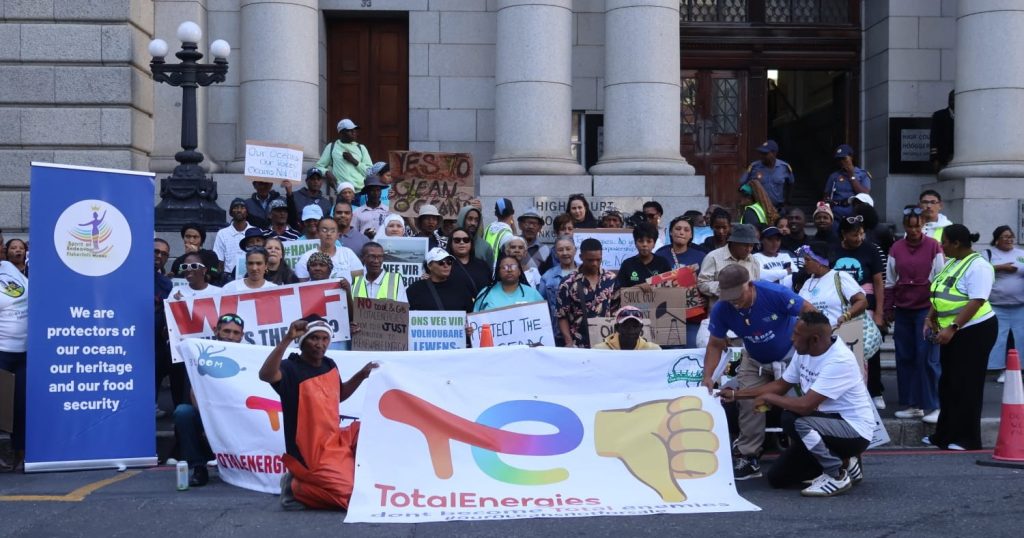 Small scale fishers and coastal community members gather outside the Western Cape High Court.