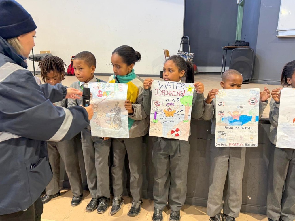 Learners and instructors come together during a water safety programme hosted by Saldanha Bay Municipality and partners.