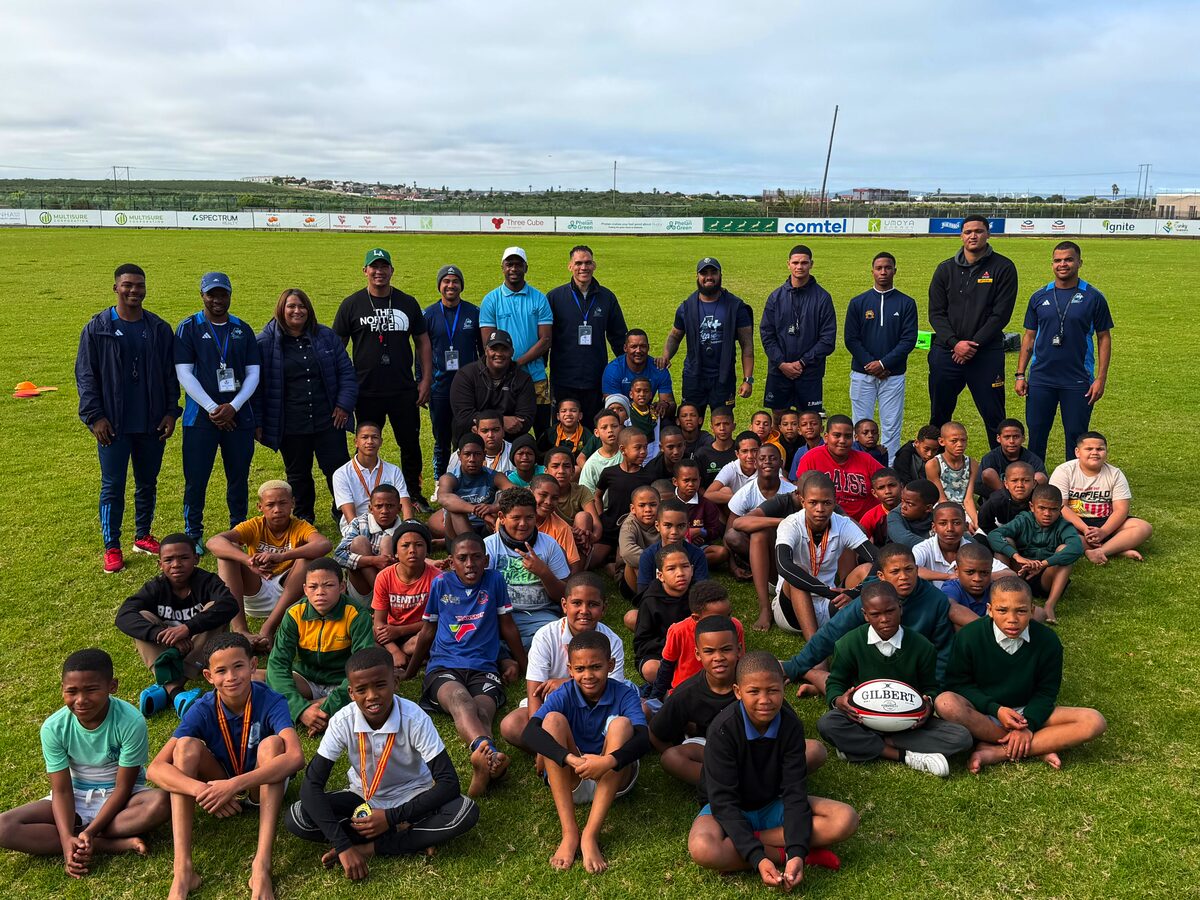 The young boys who participated in the rugby clinic along with the roleplayers.