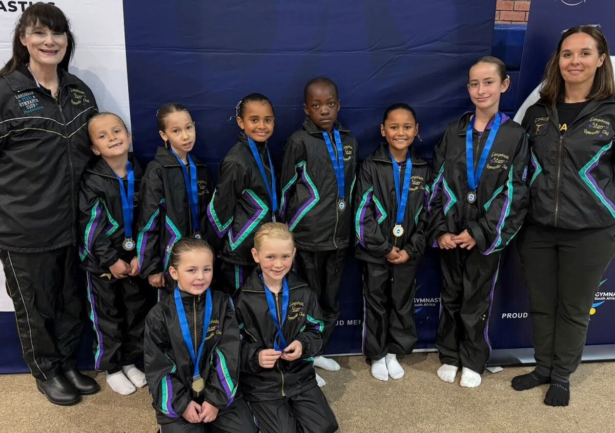 Langebaan Stars gymnasts with hteir coaches.