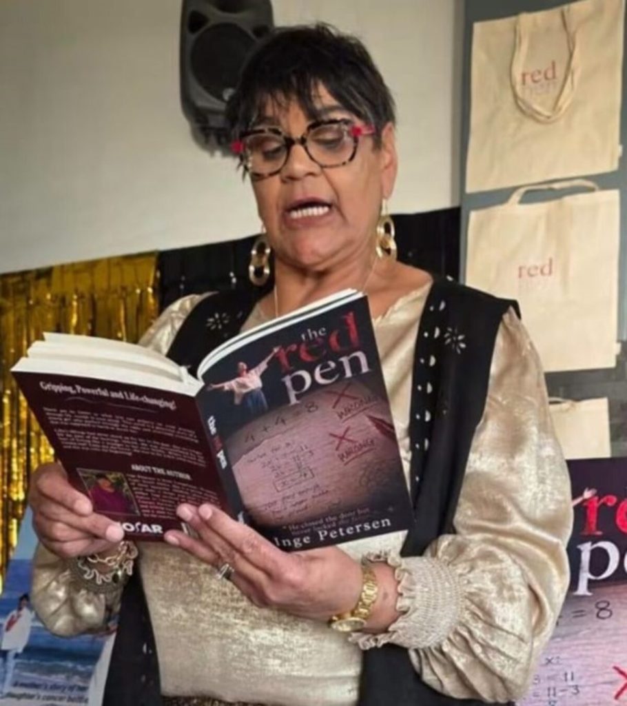 Ingrid Petersen reading a passage through her new book.