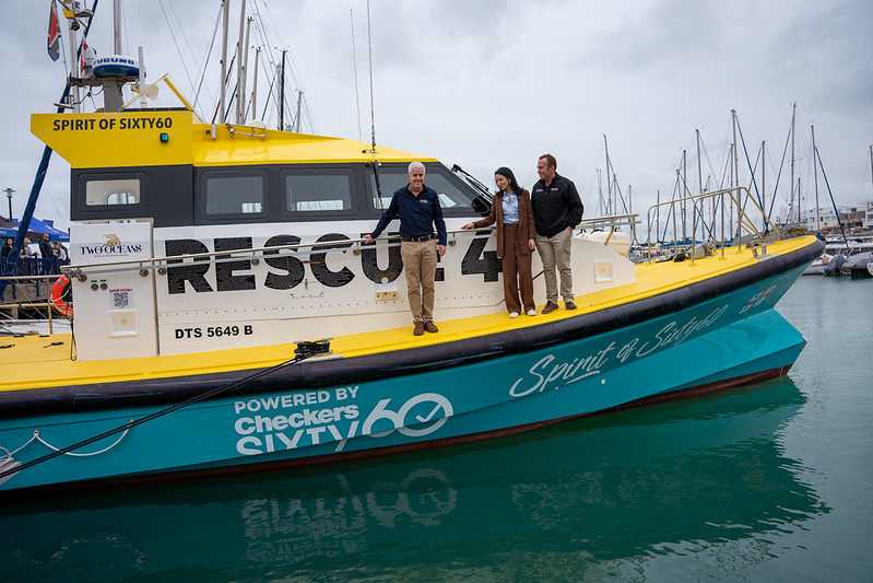 On the Rescue 4 are from left Mike Vonk, NSRI Chief Executive Officer, Ilze Bylos, Chief Marketing Officer of the Shoprite Group, and Nic Stevens, Station 4 Mykonos Station Commander. Photo: NSRI