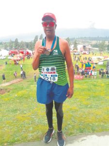 Runner celebrates medal