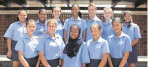 Gym and Pioneer learners hold hands