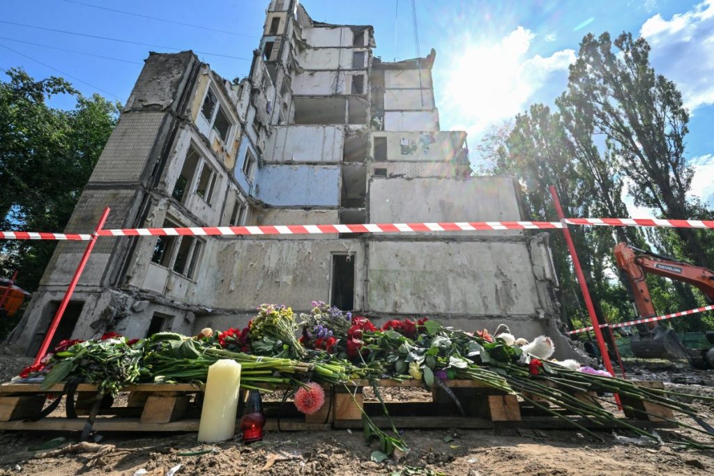 Kyiv observed a day of mourning after the deadliest attack in the Ukrainian capital this year, which ripped open a nine-storey residential building, wounding 159 people and claiming the lives of five children. (Photo by Sergei SUPINSKY / AFP)