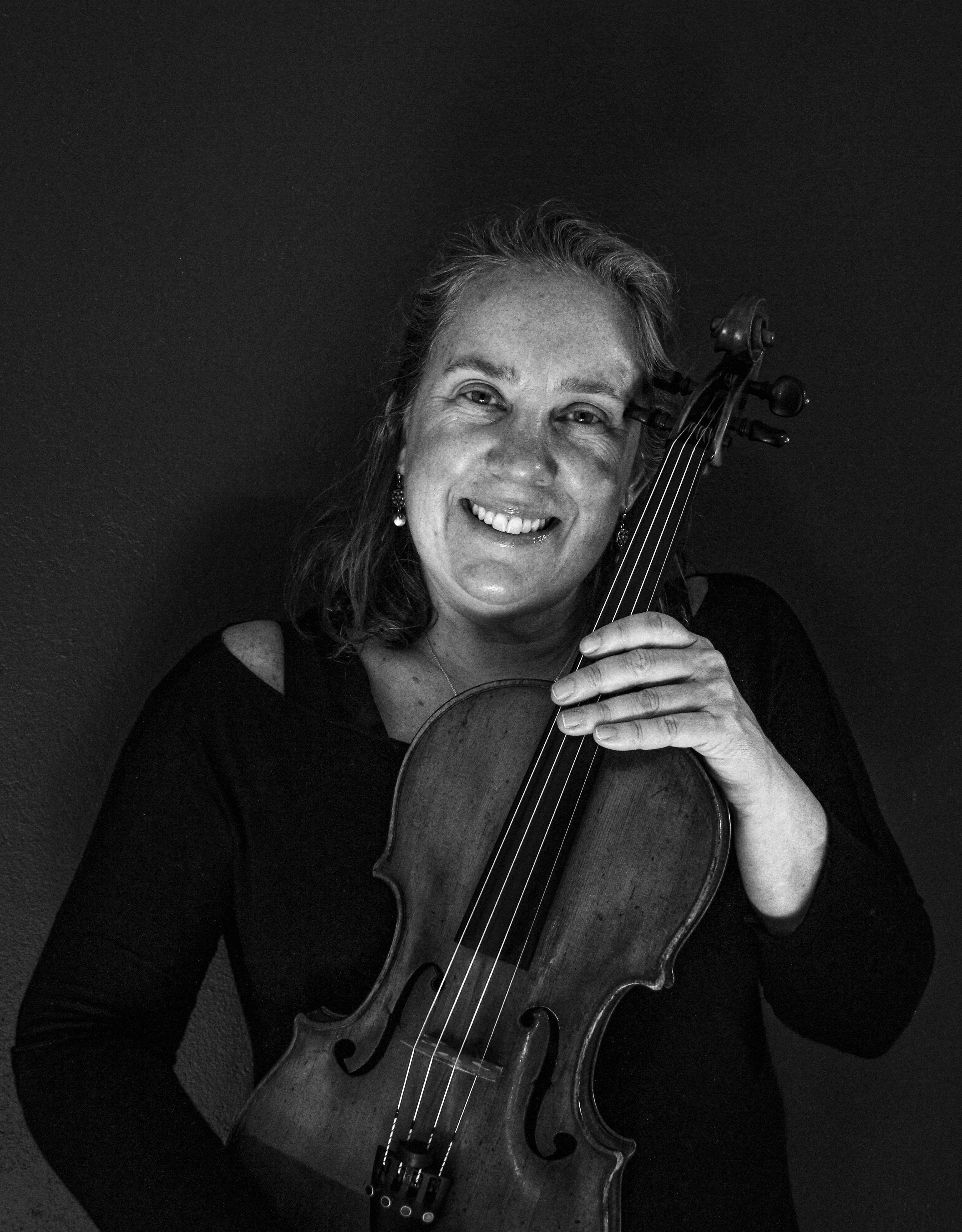 Louise Lansdown will a musical instrument.