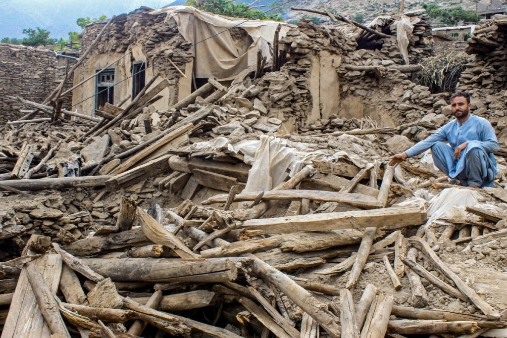 An Afghan man sits amid the remains of a damaged house, in the aftermath of an earthquake at the Dara-i-Nur district of Nangarhar province on September 3, 2025. Hope was quickly fading of finding survivors in the rubble of homes devastated by the weekend's powerful 6.0-magnitude quake in eastern Afghanistan, as emergency services struggled to reach remote villages on September 3. (Photo by AFP)