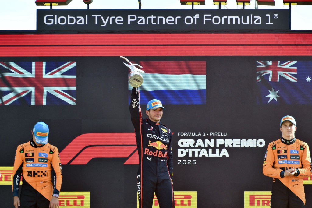 Second-placed McLaren's British driver Lando Norris (L), first-placed Red Bull Racing's Dutch driver Max Verstappen and third-placed McLaren's Australian driver Oscar Piastri (R) celebrate on the podium after the Italian Formula One Grand Prix at Monza, Italy, on Sunday (7 September). Photo: Marco Bertorello / AFP