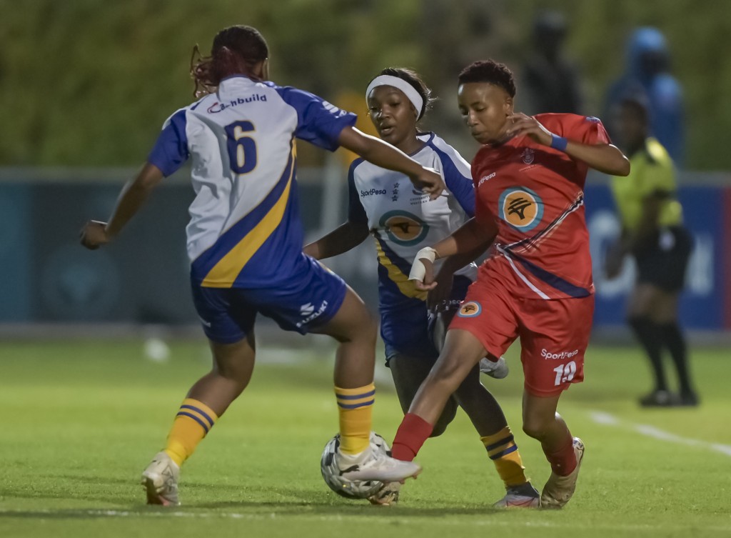 UWC's Vonisiwe Faith Maswanganyi and Nwabisa Qoba close down UNIVEN's Andani Dabana during the defending champions' commanding 10-0 victory in Round 2 of Varsity Women's Football. Photo: Christiaan Kotze/ Asem Engage