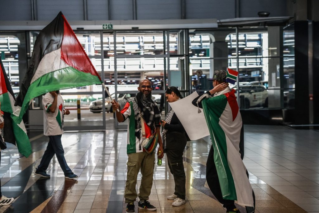 A group of six South African activists, including Nelson Mandela's grandson Mandla Mandela, arrived at OR Tambo International Airport on Wednesday morning to a hero's welcome after being detained by Israeli forces while attempting to deliver humanitarian aid to Gaza.